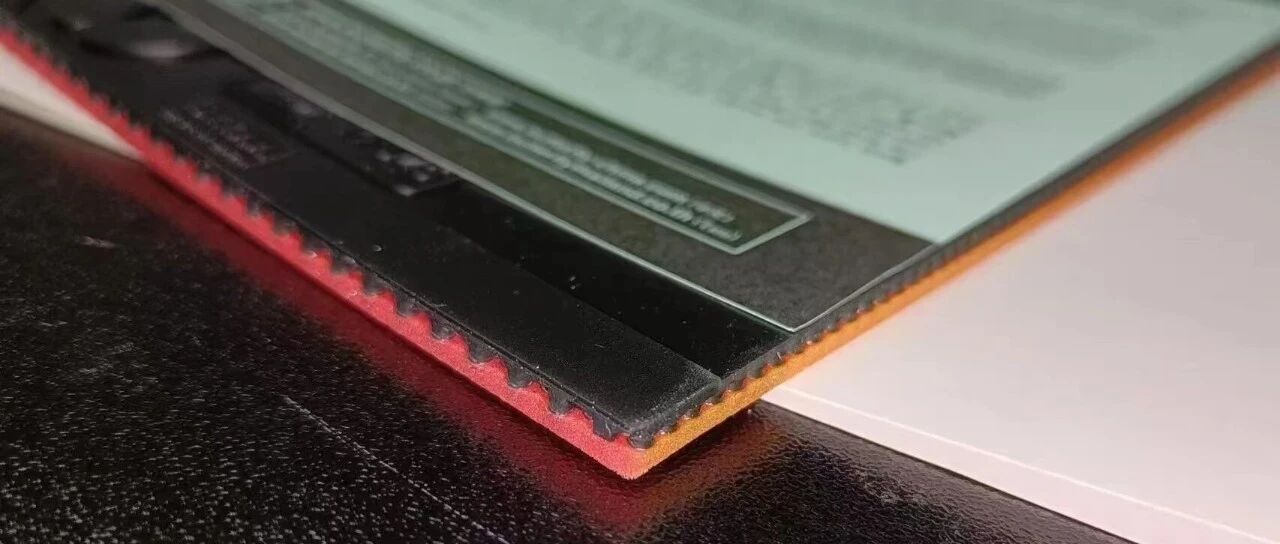 Close-up of table tennis rubber sponge layers showing thickness and texture
