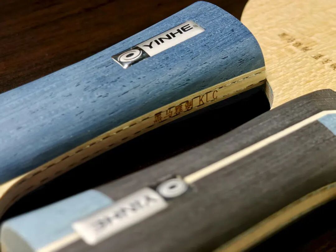 Yinhe KLC blade handles side by side, close-up showing the KLC branding on the wood