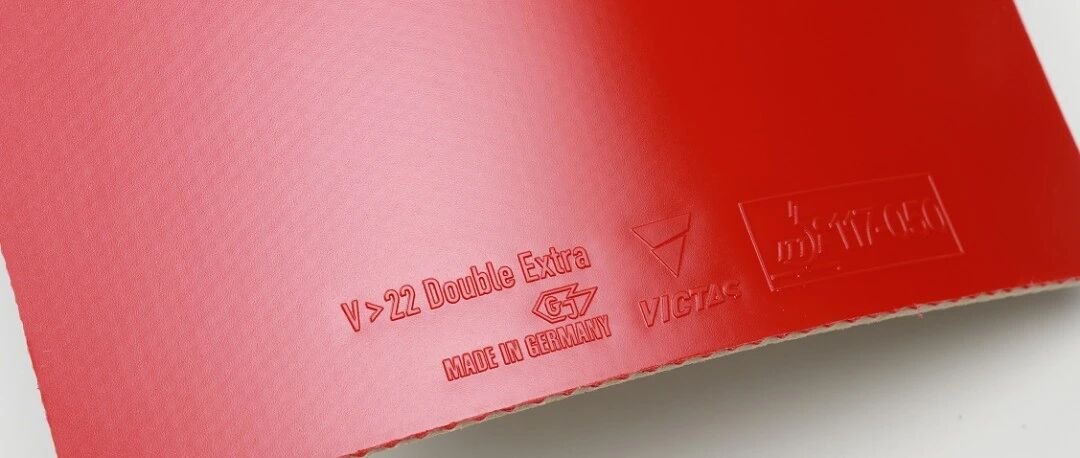 Victas V22 Double Extra red rubber sheet showing the embossed brand name on its back surface