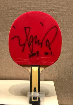 Ishikawa Kasumi in match play showing her defensive block and racket-angle adjustment