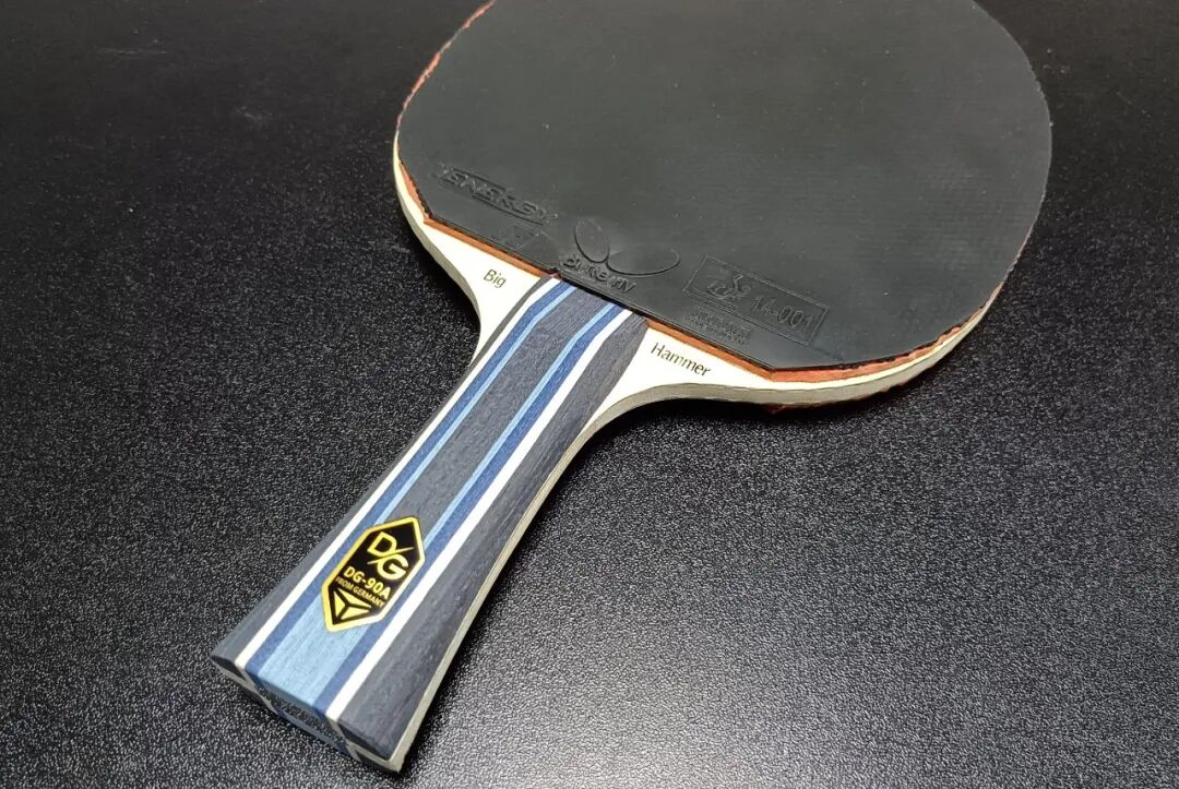 Tibhar Golden Tornado series blade face showing logo and carbon weave detail