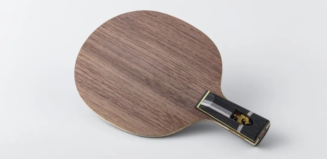 Bharal penhold blade by DHS shown face-on beside Super Zhang Jike for size comparison