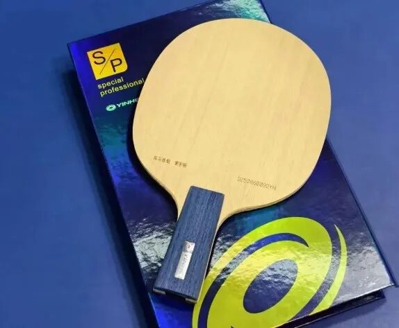 Ma Long in match stance demonstrating backhand-then-forehand tactical positioning