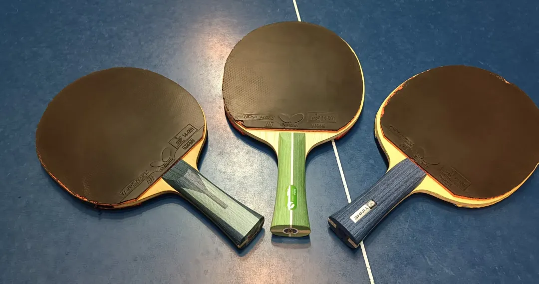 Professional player performing a deceptive low serve, disguising spin to fool the opponent