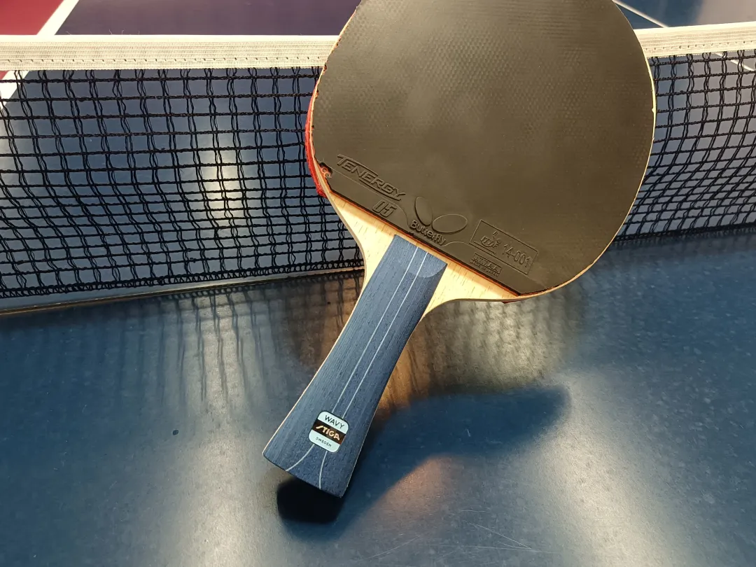 Stiga Power Carbon outer white super fiber blade shown beside a table tennis ball