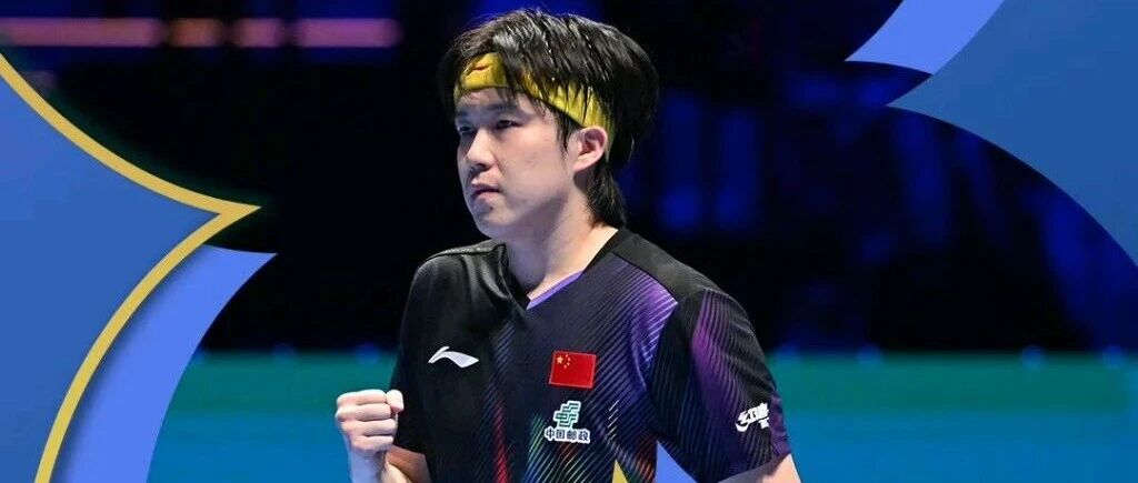 Wang Chuqin pumps his fist in celebration at the Macao World Cup