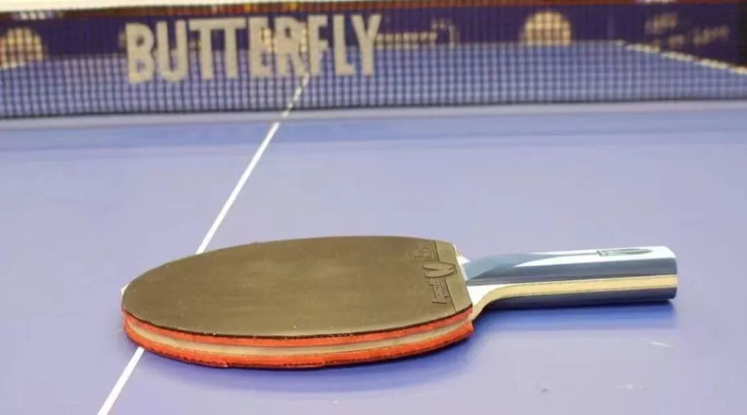 Timo Boll and Qiu Dang practicing with fresh rubber at a training session