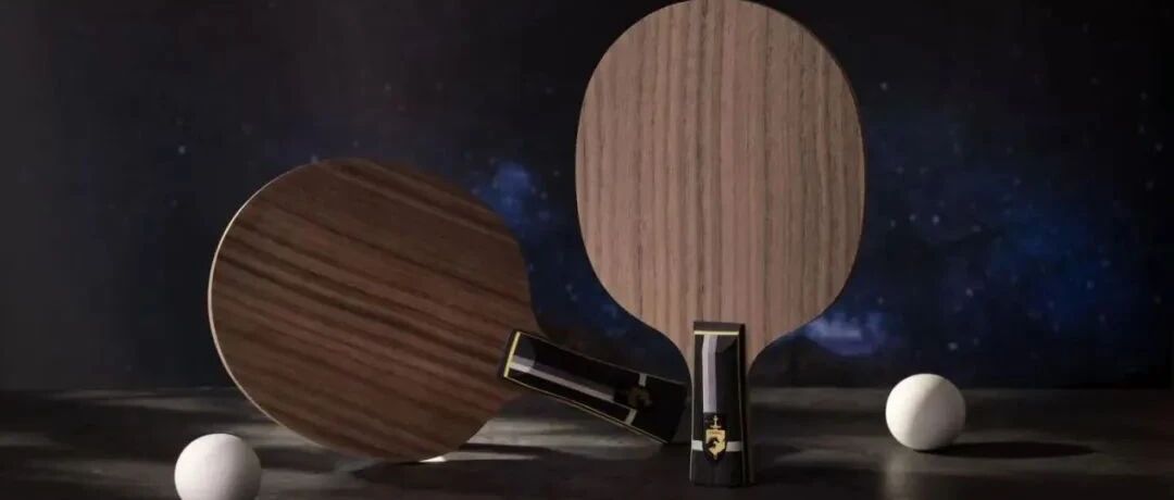 Two table tennis blades displayed against a starry night backdrop