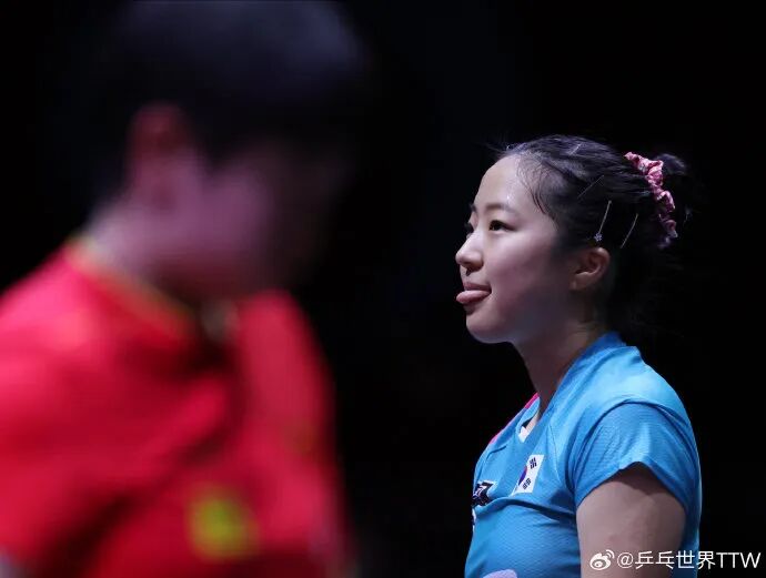 Shin Yubin playing forehand loop during professional match competition