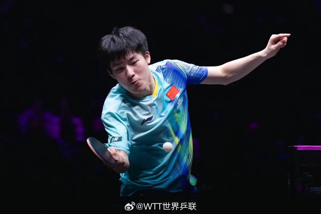 Wen Ruibo in defensive position during WTT Chongqing men's singles final against Felix LeBrun