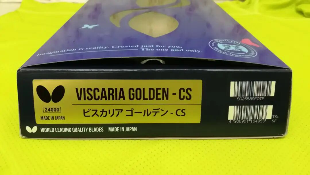 Golden-label Viscaria blade close-up showing gold foil label and carbon fiber layers