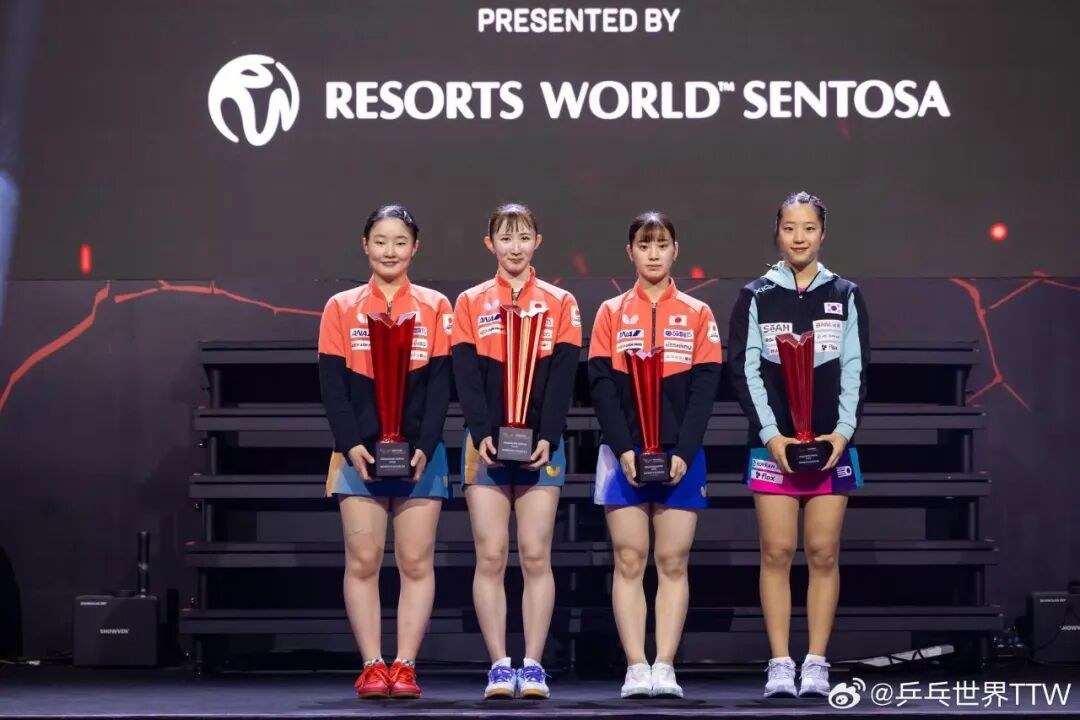 Hina Hayata women's doubles champions with Harimoto SALC blade on the podium
