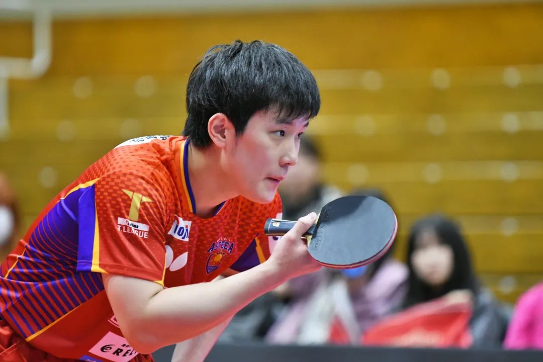 Professional table tennis match scene with players competing at high-level tournament