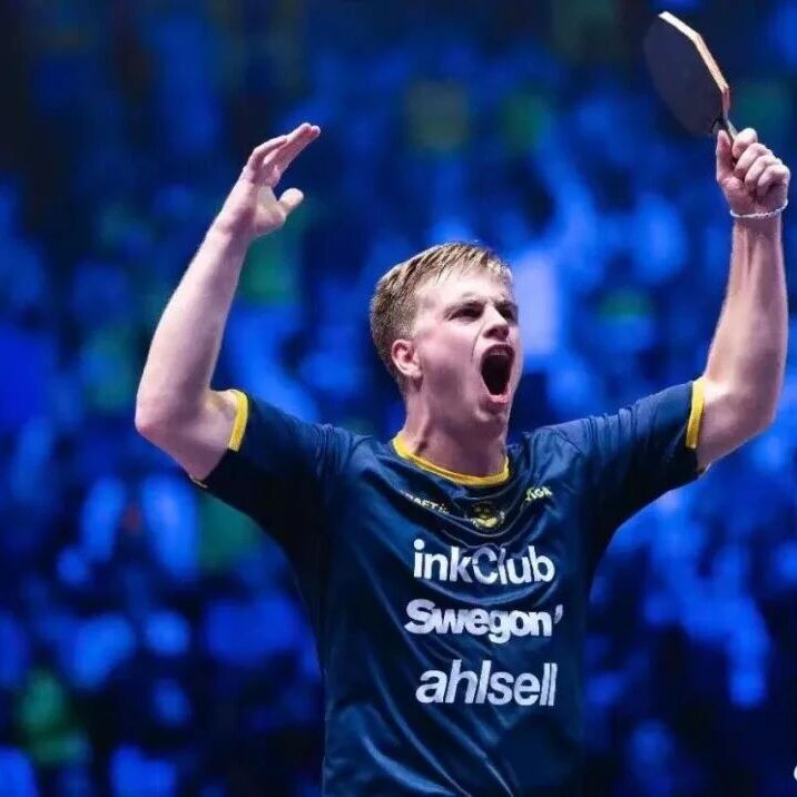 Truls Möregård celebrating with arms raised during a match