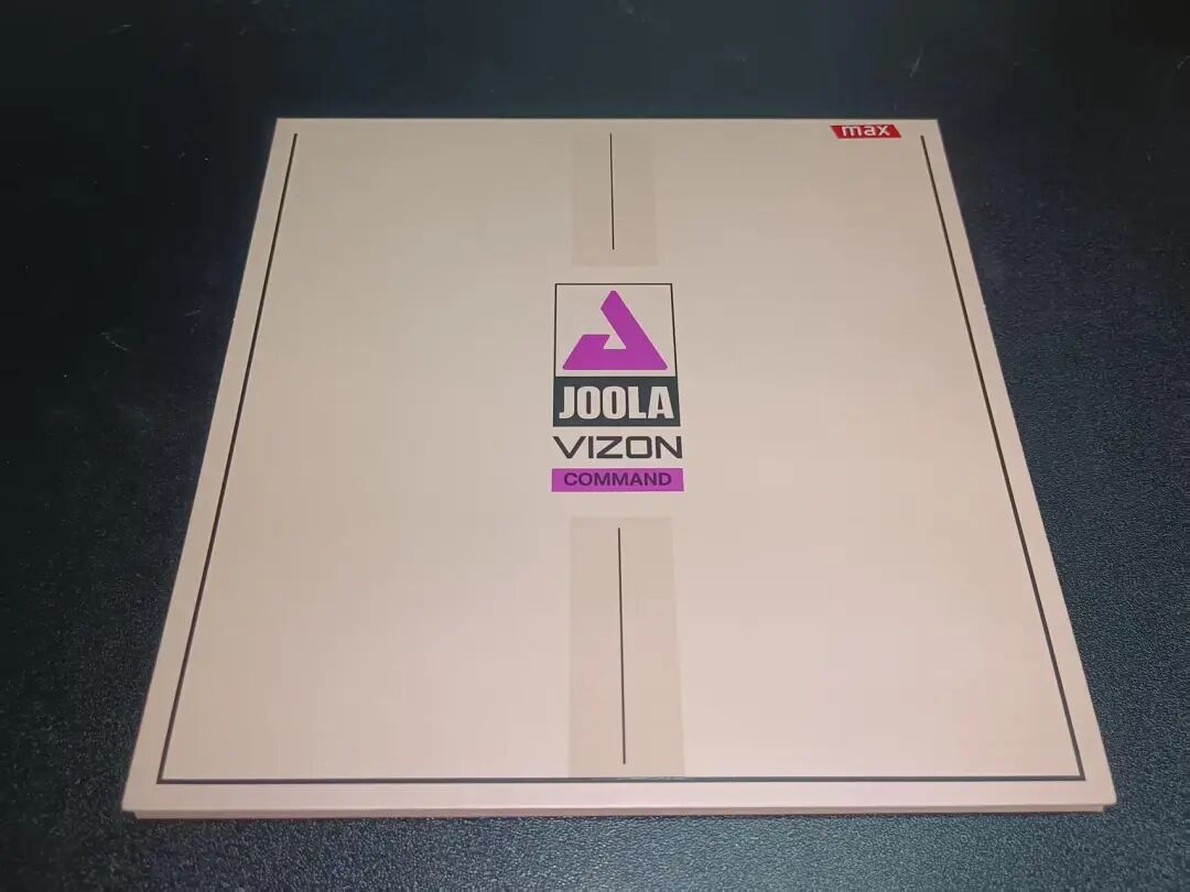 JOOLA Micron Dynamic rubber sheet showing slightly tacky topsheet and purple sponge