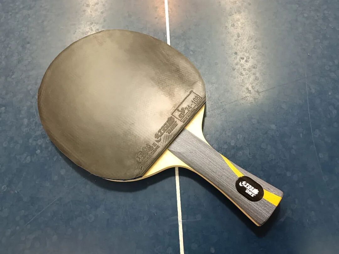 Hurricane 3 rubber sheet with tacky topsheet surface on a table tennis blade