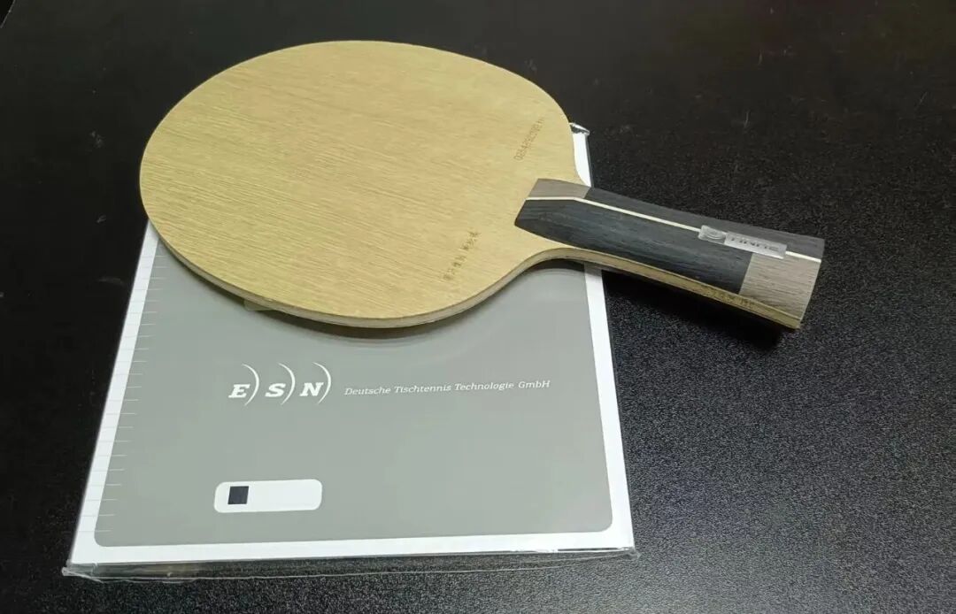 ESN semi-tacky rubber sample on testing paddle for comparison review