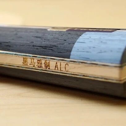 Table tennis blade with ALC carbon construction label on the handle