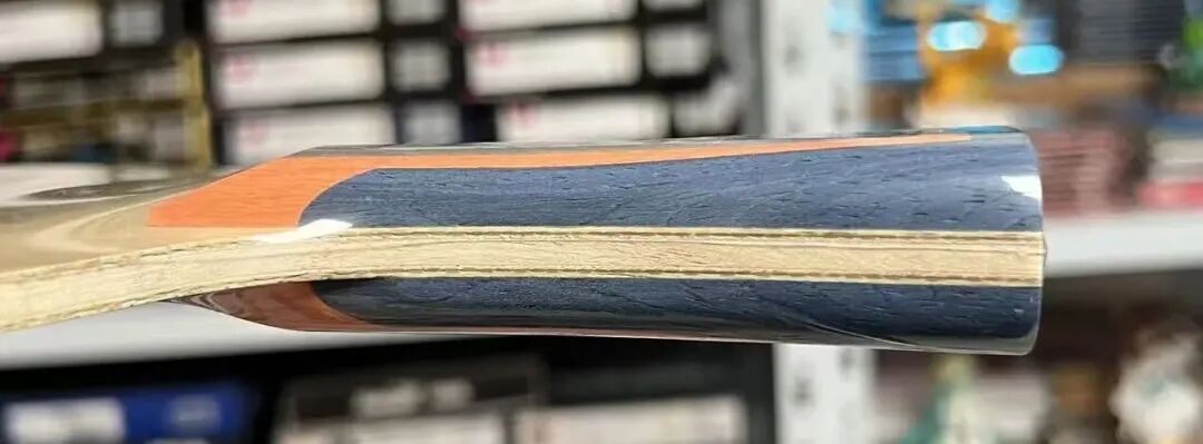 Loki Wei Shihao ZC outer ZLC blade close-up showing orange-gray-blue handle