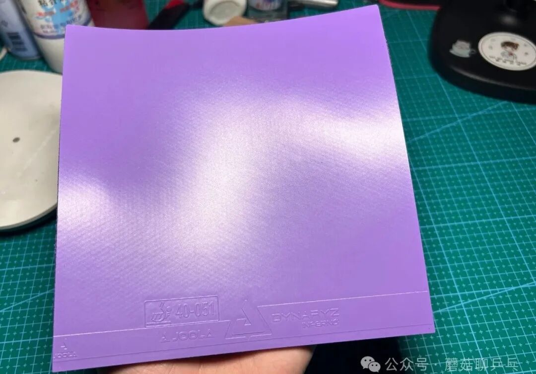 Joola Dynasty Inferno purple rubber sponge layer thickness visible from the side