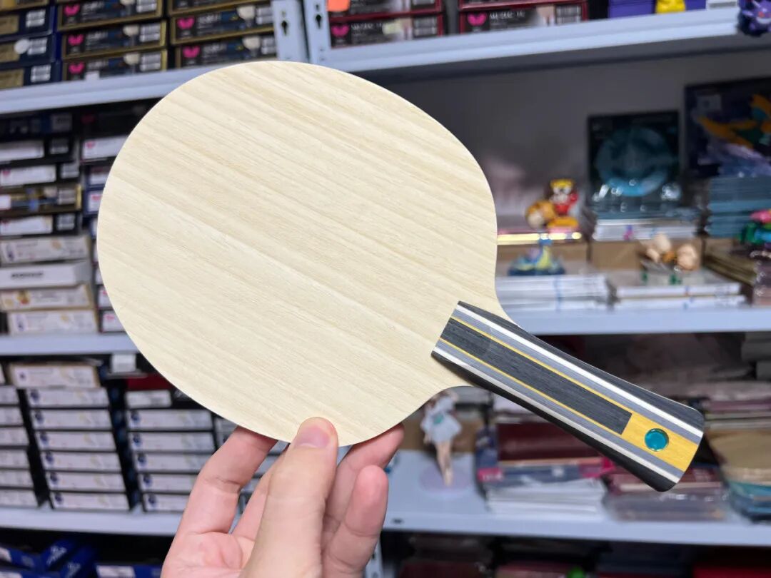 Fan Zhendong SZLC blade back face showing wood grain and blade markings