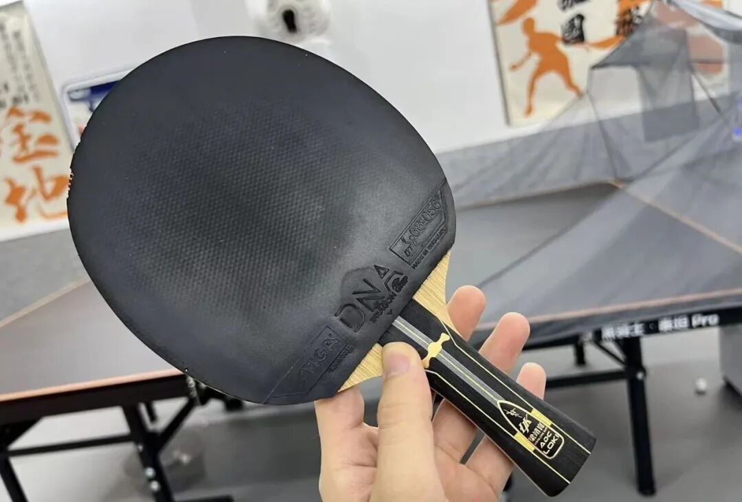 Reviewer performing backhand stroke test with Liang Jingkun ADC R-Code blade in club session