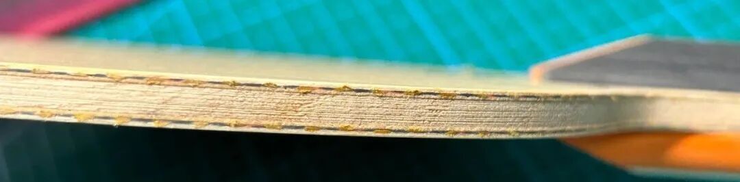 Close-up of XIOM Cho Dae-Seong TMX PRO straight handle grip showing color layers