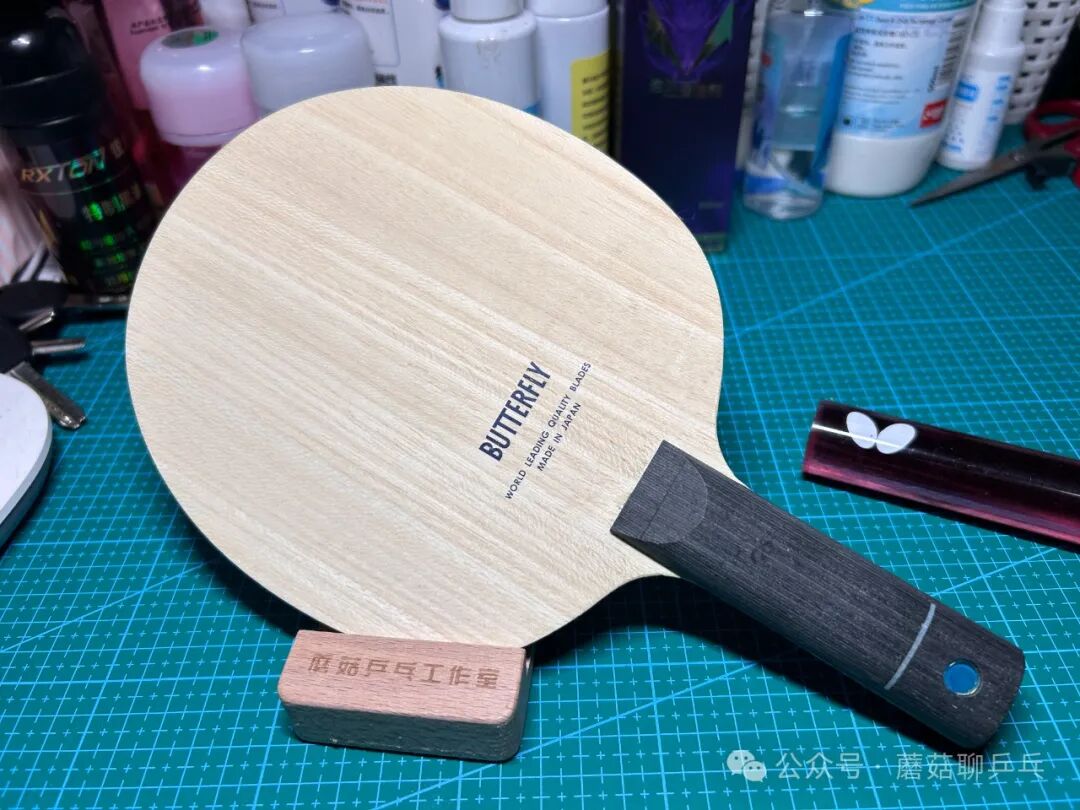 Close-up of Timo Boll ALC blade face showing the classic blue sword logo