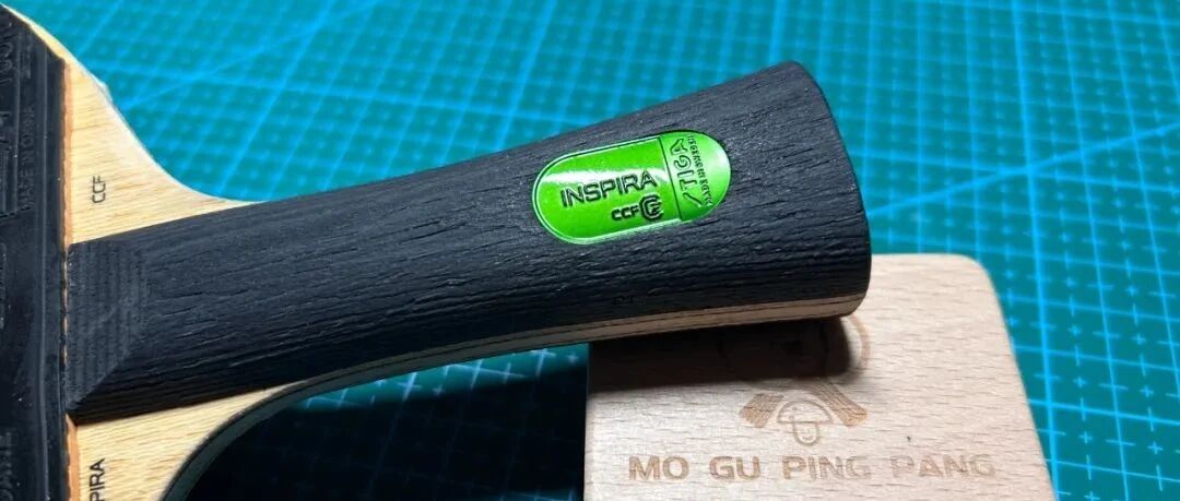 Stiga Inspira Carbon blade with black ITTF-approved handle closeup