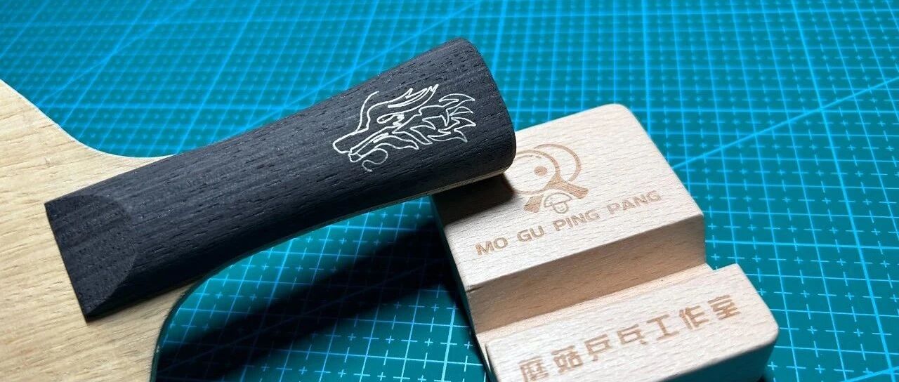 DHS Hurricane Wang Chuqin carbon blade standing on a cutting mat