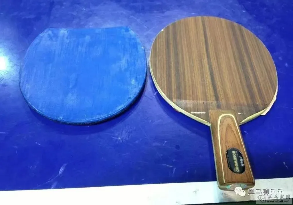 Close-up of Stiga Rosewood 5 penhold blade showing water-drop head shape and grain