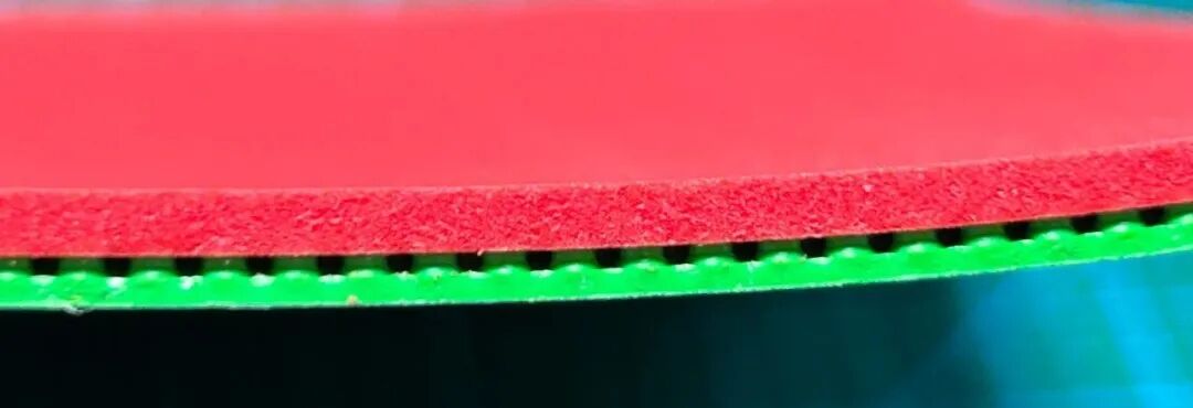 DHS Hurricane 9 Fruit Green and Dazzling Purple table tennis rubbers side by side