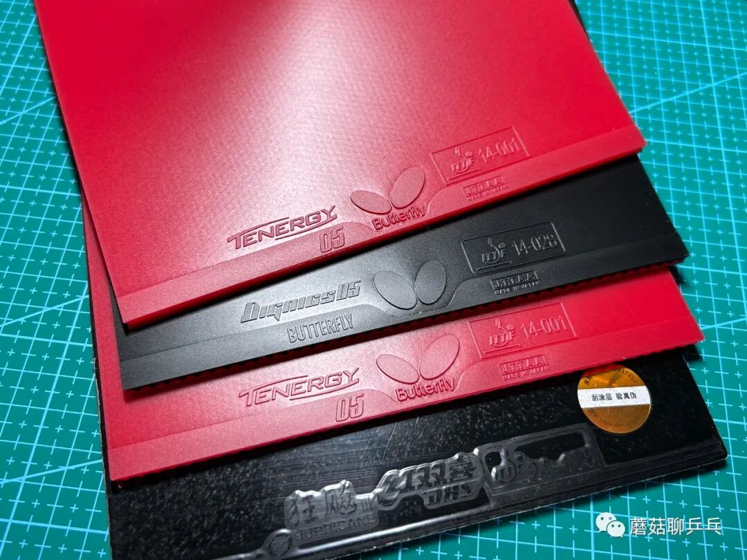 Assortment of used table tennis rubber sheets showing varying degrees of wear