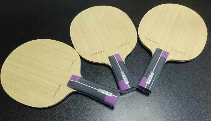 ASICS and Mizuno table tennis shoe outsoles showing durable rubber sole construction