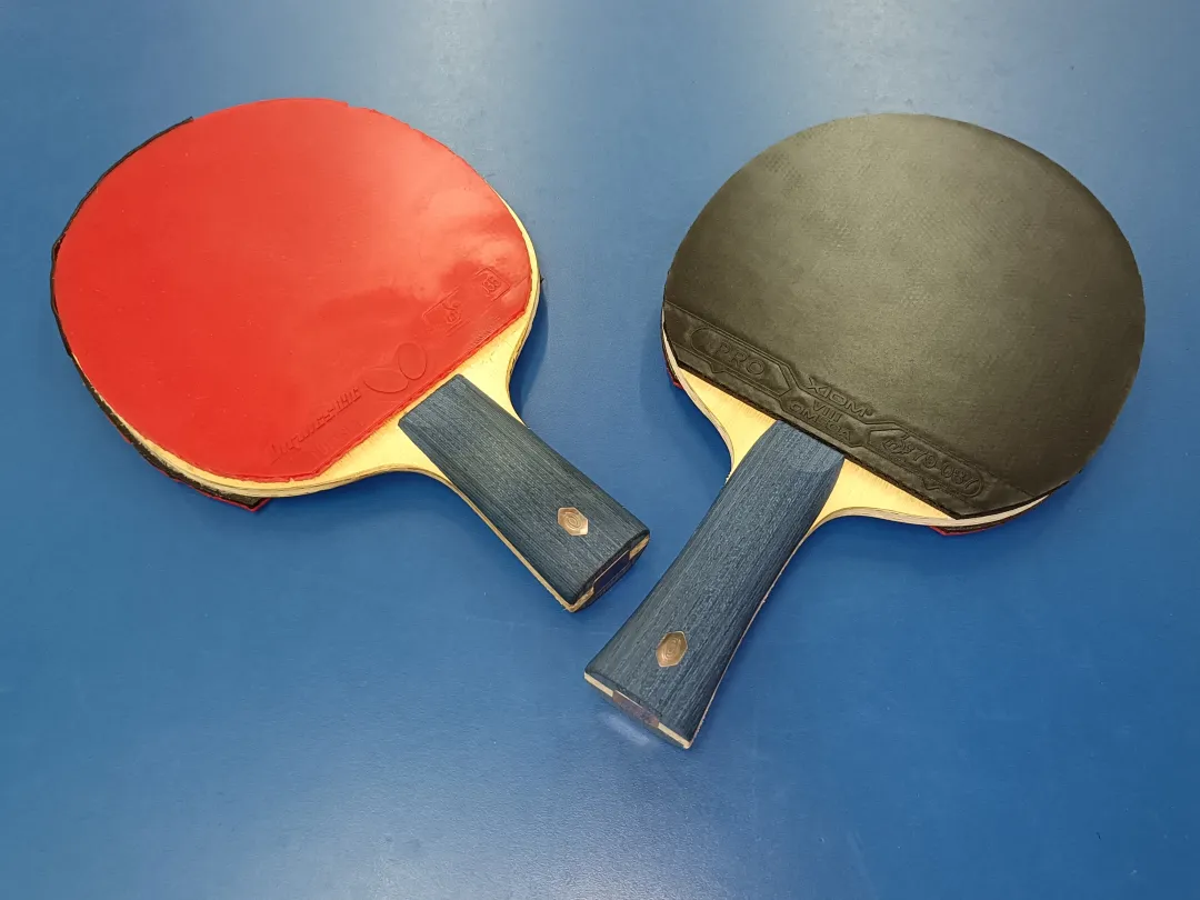 Butterfly Tenergy flagship rubber next to a European tacky-free German rubber sheet