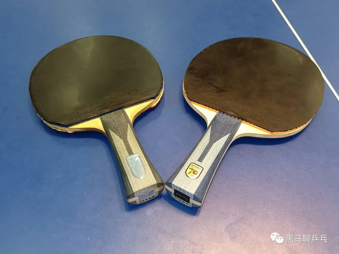 Two Butterfly table tennis blades side by side on a blue table