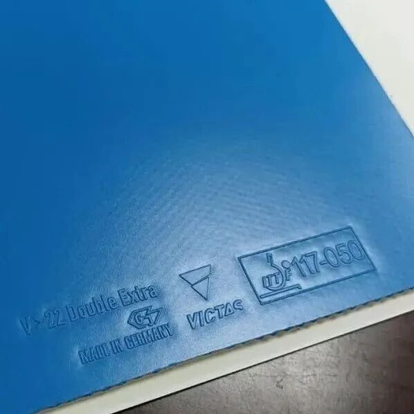 A blue Victas V22 Double Extra rubber sheet shot close-up showing the surface texture and ITTF stamp