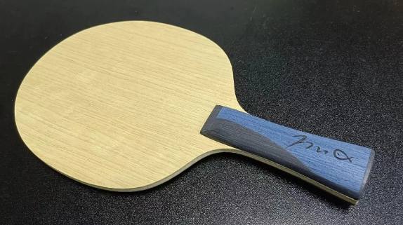 Young table tennis player learning body weight transfer technique with coach guidance