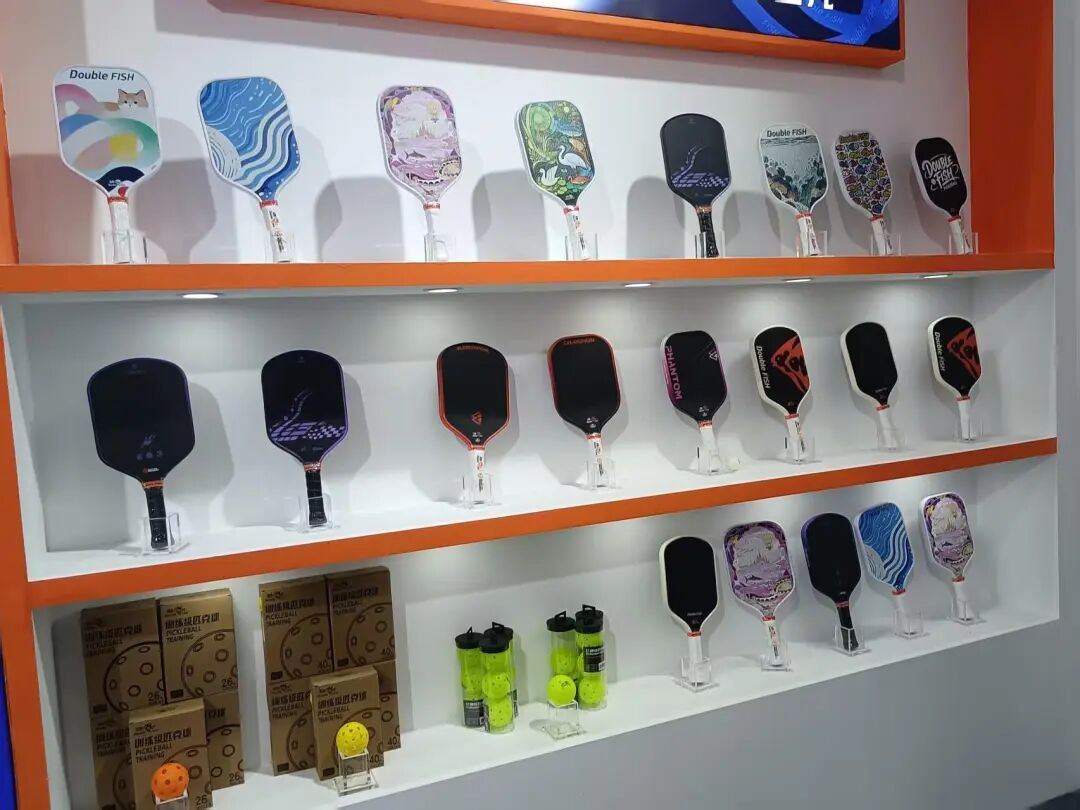 Double Fish smaller table tennis accessories and novelty items at booth