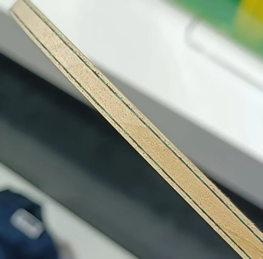 JOOLA Hugo Calderano 968 inner green aramid carbon blade showing fiber layers