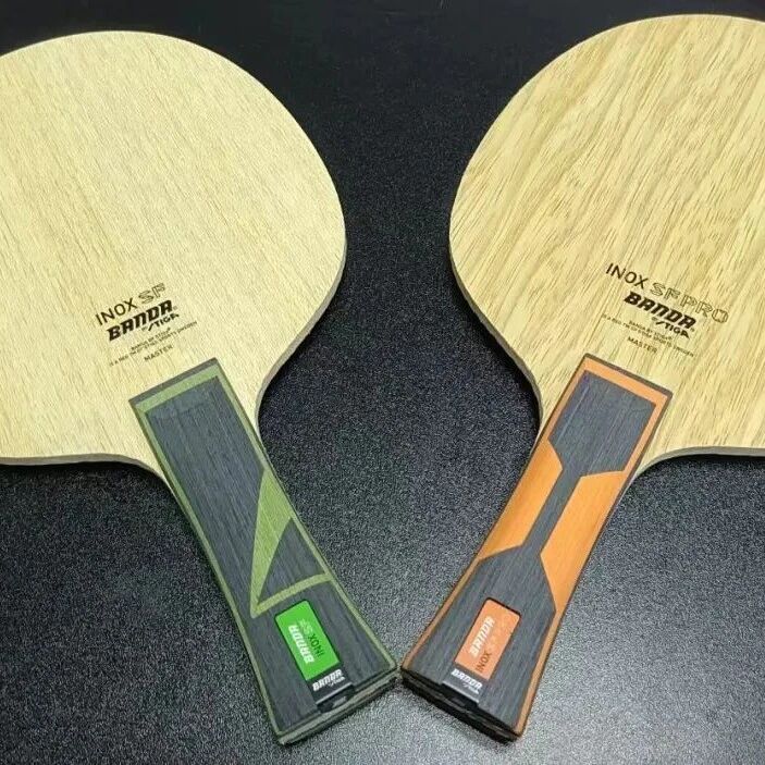 Two table tennis blades side by side showing different handle thicknesses and construction