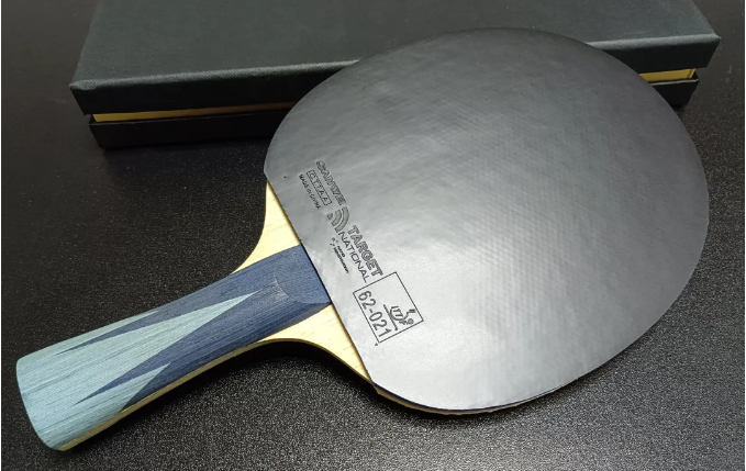 National Standard 3 rubber with white-crepe compound topsheet on paddle