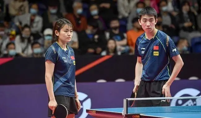 Chopping player Liu Fei and Ma Te at a competitive table tennis event