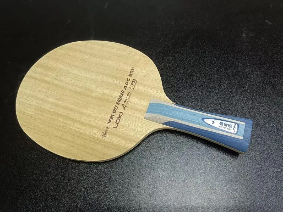 Loki Wei Shihao ADC blade face showing Limba ply and aramid carbon fiber layer