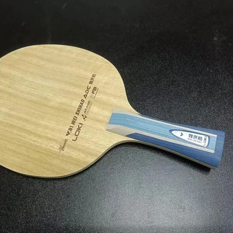 Loki Wei Shihao ADC blade showing the face and blue handle detail on a dark background