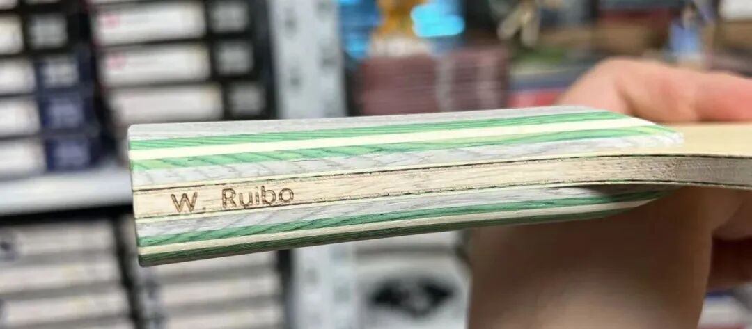 Wen Ruibo athlete fire stamp on the Stiga Luma pro-stock blade handle