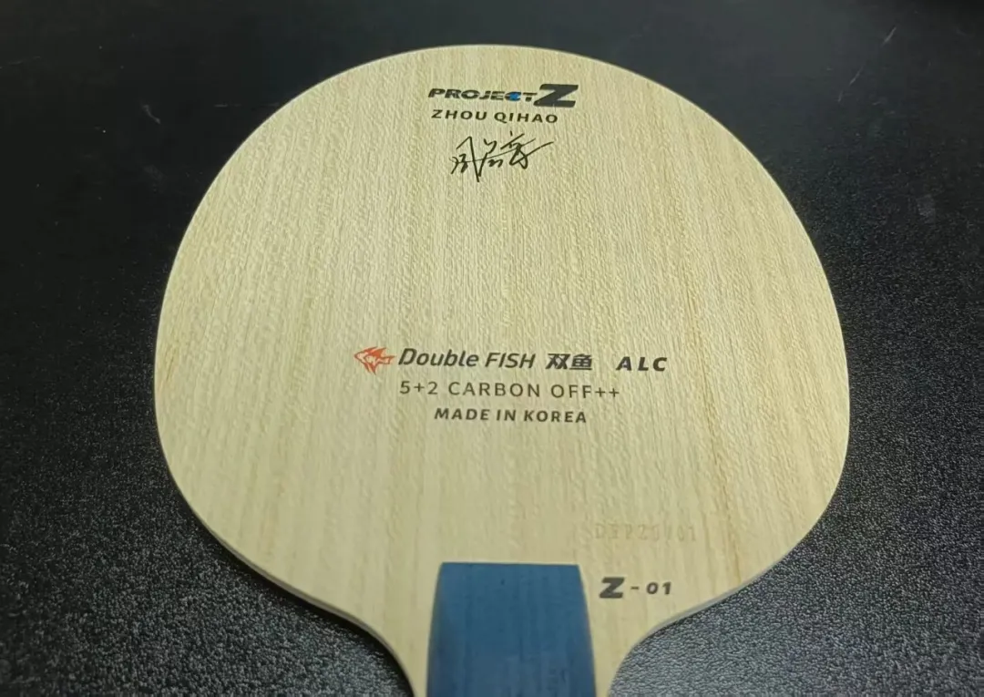 Double Fish ALC 5+2 Carbon Project Z Zhou Qihao blade front face showing brand label