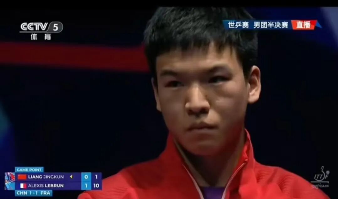 Liang Jingkun down 0-2 looking dejected against Alexis Lebrun in World Team Championship semifinal