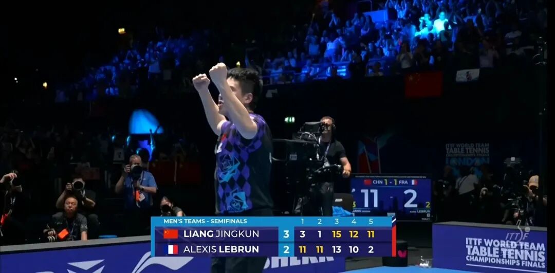 Liang Jingkun celebrates completing five-game comeback victory over Alexis Lebrun