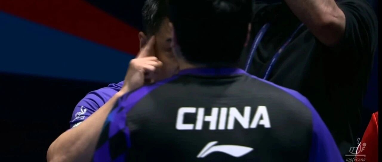 Liang Jingkun celebrates winning the decisive game against Alexis Lebrun at the World Team Championships